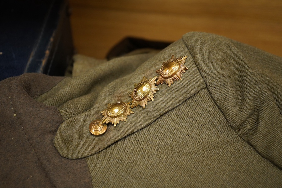 A WWII Welsh Guard’s uniform, comprising a dress jacket, two dress blouses, one with label stating 1940 Pattern Size No.6, breast 38” to 39”, waist 33” to 34”, a pair of breeches, a pair of trousers and a tie, together w